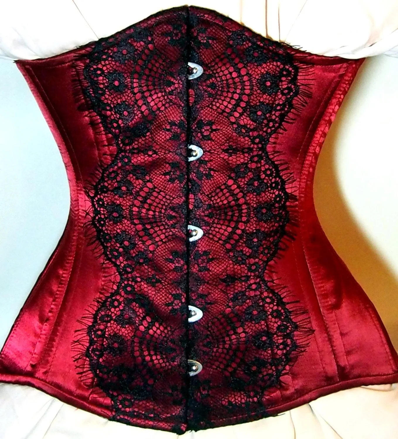 Exclusive red and black corset covered by laces. Lace Addicted Corsettery collection. Gothic, custom made, steampunk, waist training corset